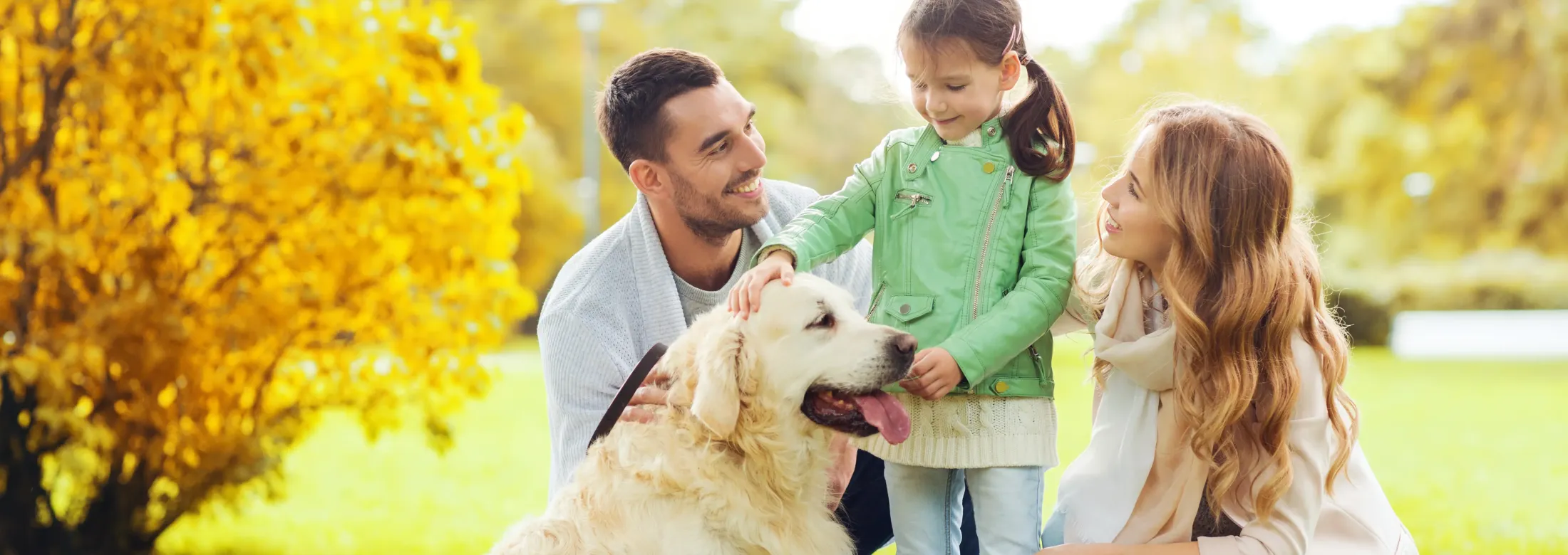 family outside with dog