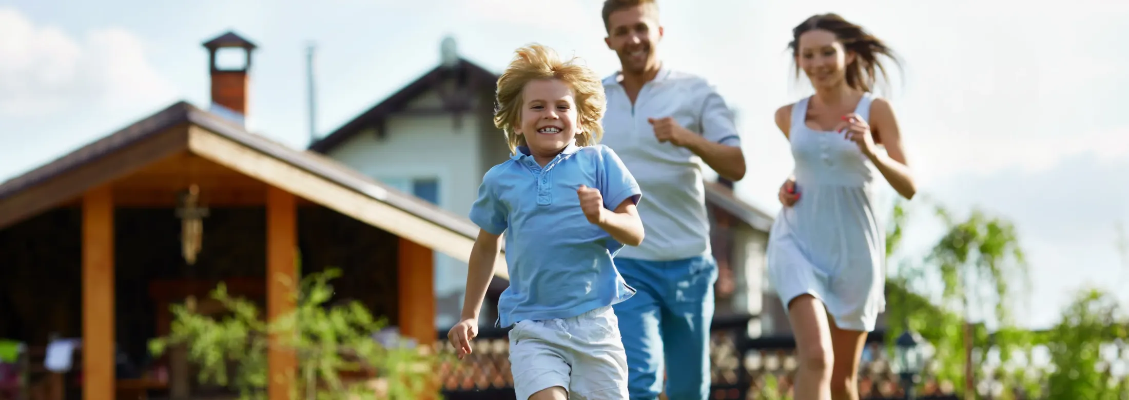family running outside in backyard 